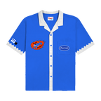 Blue James Marriott bowling shirt with white accents and graphic logos.
